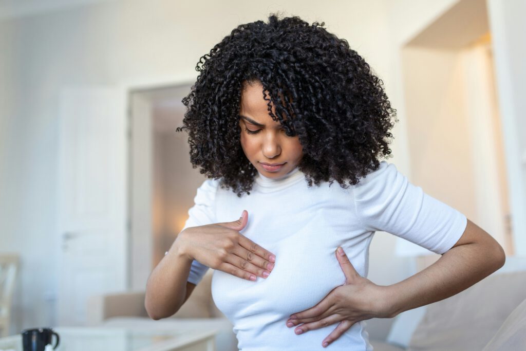 Woman massaging her own breast
